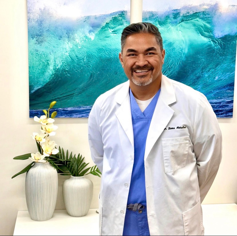 Dr. Siona Motufau in a white coat at Ohana